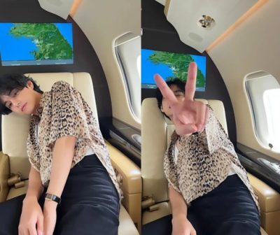 The 1995 male idol smiles when he creates a peace symbol by hand - BTS V in Paris